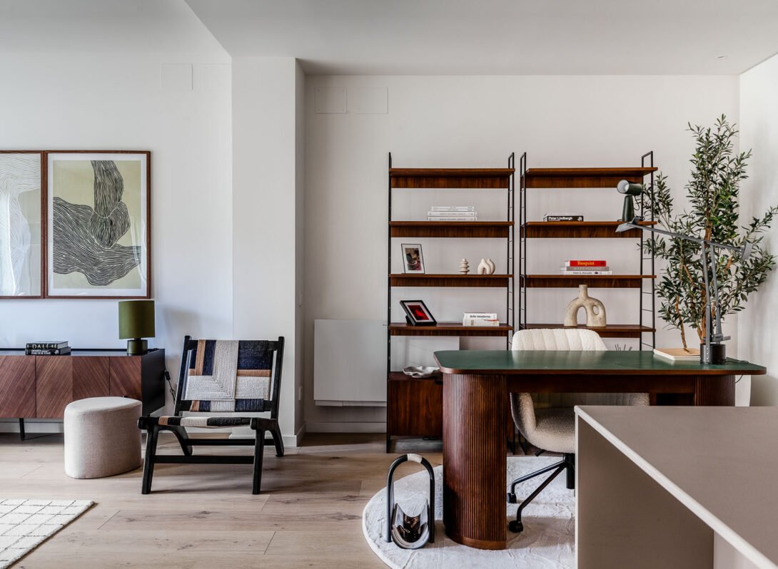 Living space includes lounge area and study desk decorated in a contemporary mid century style green and brown tones