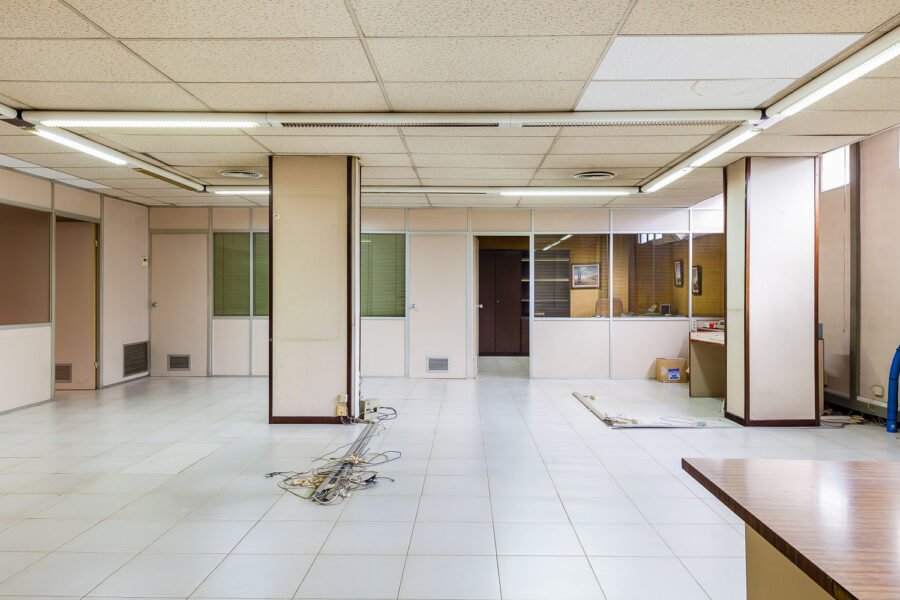 An empty Commercial office space with cables on the floor