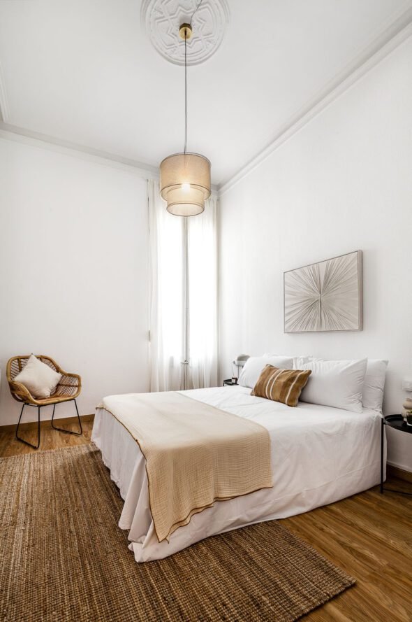 Double bedroom shot in beautiful diffused light with art deco styled furnishing.
