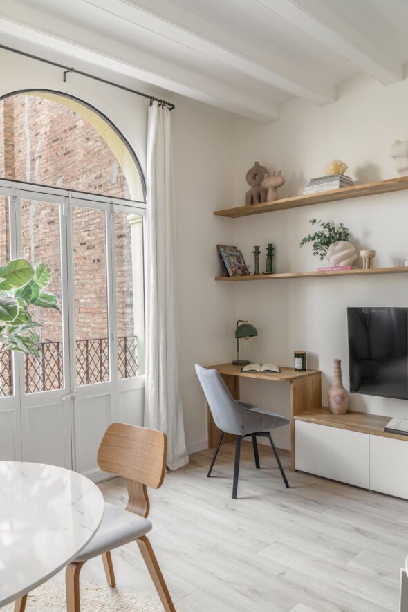 soft natural light in a dining and working living space decorated with natural materials consisting of wooden and marble.