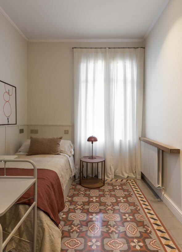 Single bedroom, burgandy, natural linen hues, mosaic floor,side tale and wall art