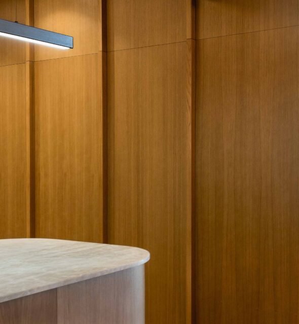 close up of detailed handcrafted floor to ceiling wooden cabinetry in contemporary kitchen in Barcelona