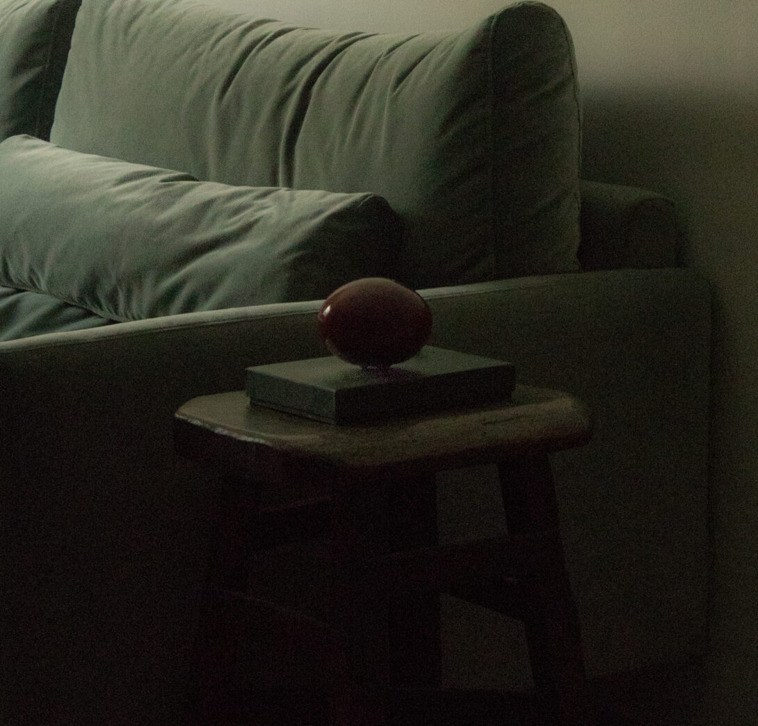 deep-red-ceramic-ball-british-racing-green-velvet-sofa-barcelona-eixample-apartment