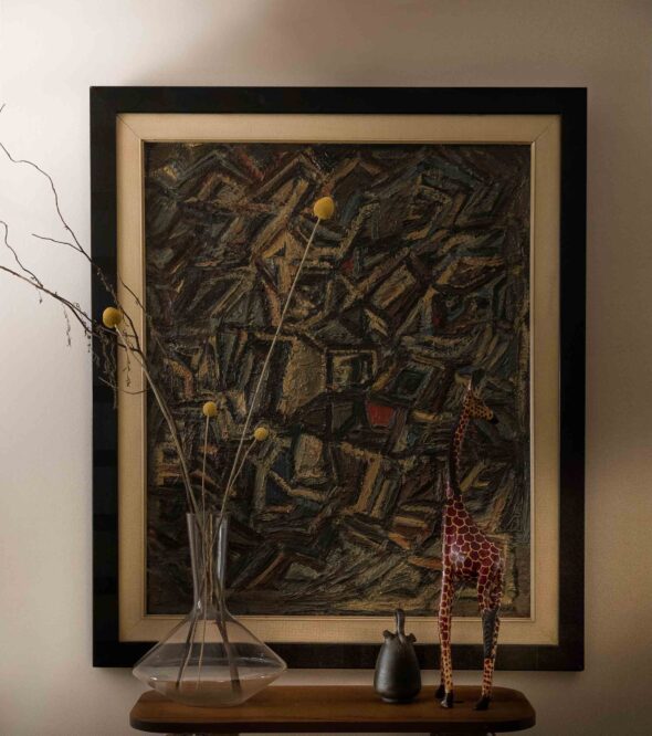 abstract-artwork-wooden-giraffe-glass vase-yellow buds
